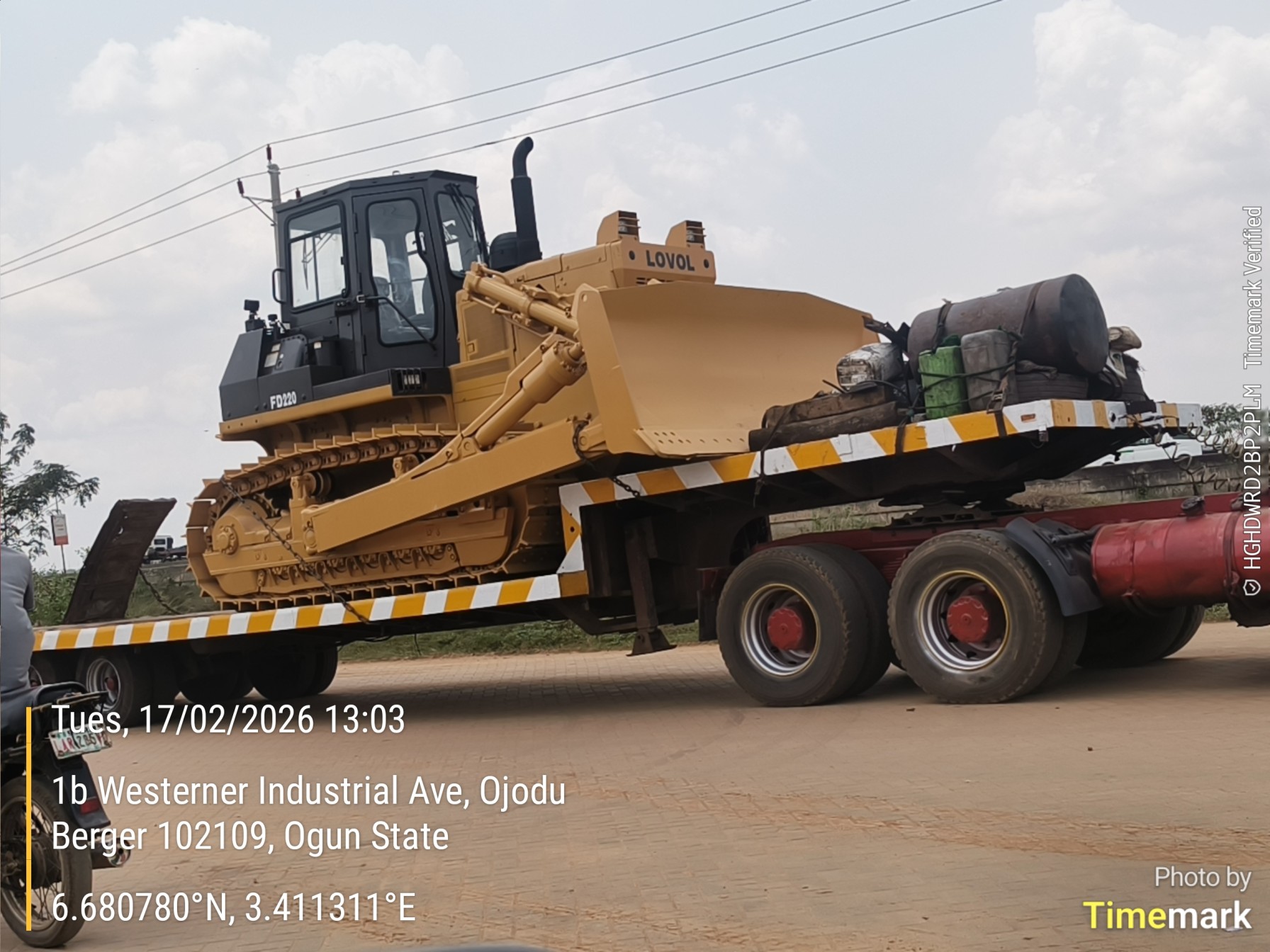LOVOL FD220 bulldozer secured on a flatbed trailer